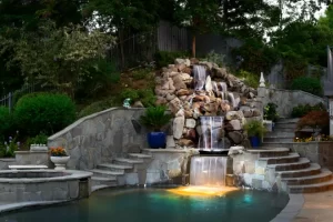 A backyard pond with a waterfall after remodeling - backyard pond repair signs