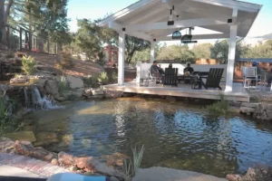 A koi pond next to a covered seating area - koi pond vs. recreation pond
